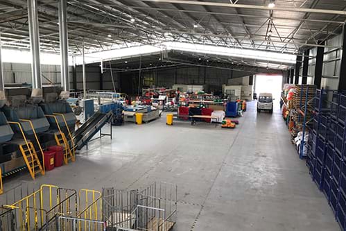 Image of a large warehouse full of linen ready for clients